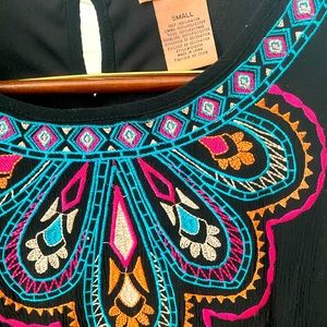 Flying tomato embroidered black dress.